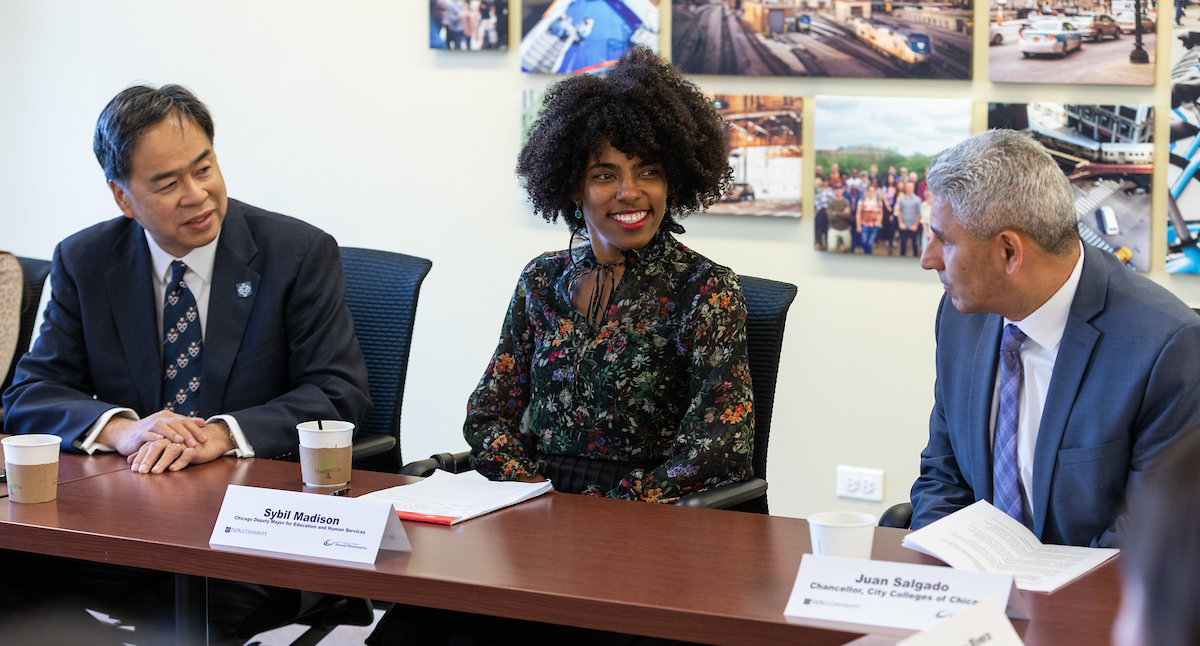 Left to right, A. Gabriel Esteban, Ph.D., president of DePaul; Sybil Madison, deputy mayor for education and human services, city of Chicago; and Juan Salgado, chancellor, City Colleges of Chicago, meet with students enrolled in the DePaul Harold Washington Academy